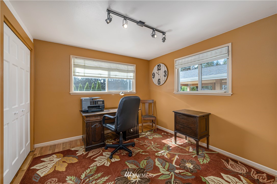 18003 Rhodes Lake Road East Bonney Lake, WA 98391 - Photo 13 of 40 a view of a workspace with furniture and a window