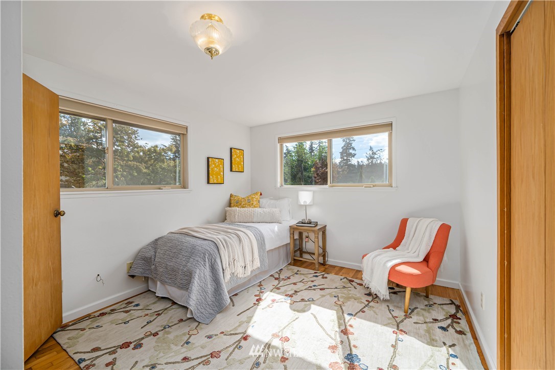 18003 Rhodes Lake Road East Bonney Lake, WA 98391 - Photo 14 of 40 a bedroom with furniture and a window
