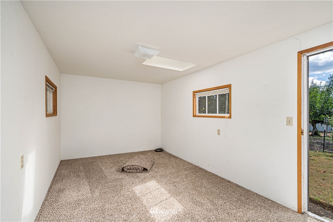 18003 Rhodes Lake Road East Bonney Lake, WA 98391 - Photo 25 of 40 a view of a room with window