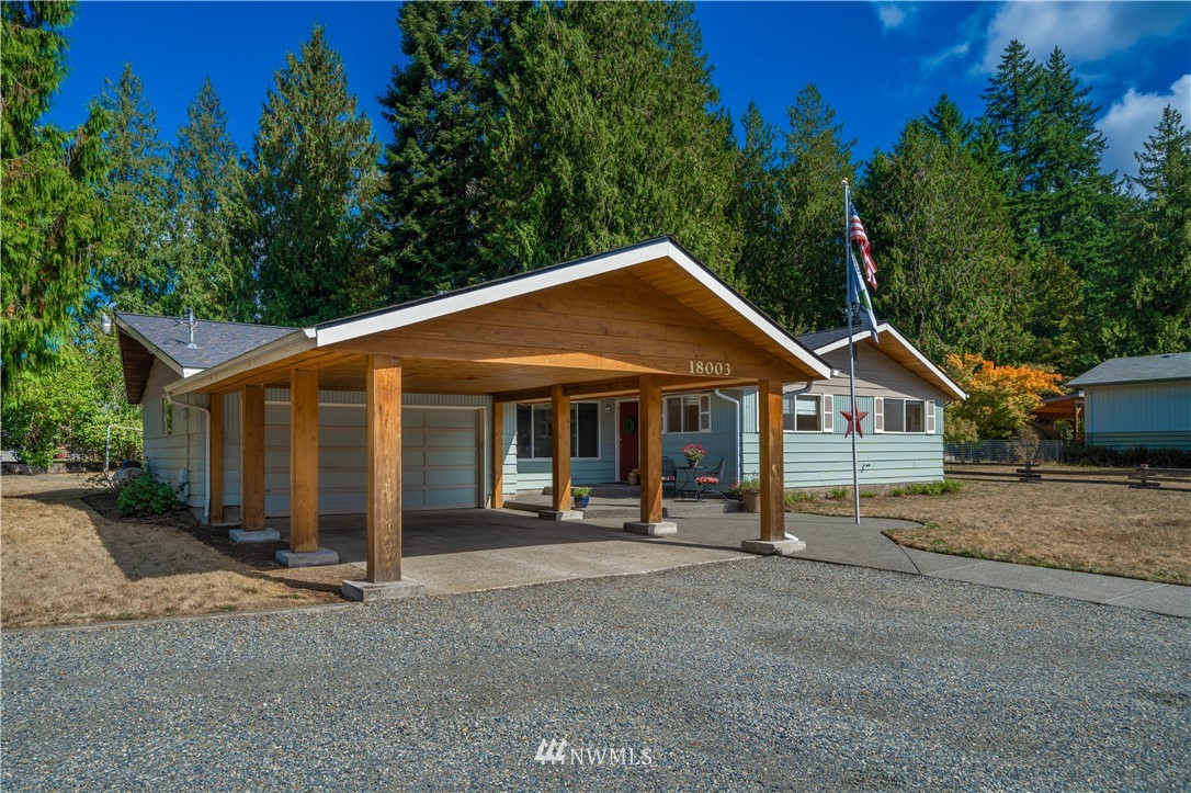 18003 Rhodes Lake Road East Bonney Lake, WA 98391 - Photo 30 of 40 a view of a house with a yard and large tree