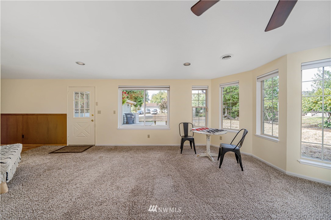 18003 Rhodes Lake Road East Bonney Lake, WA 98391 - Photo 4 of 40 a view of a livingroom with furniture and a window