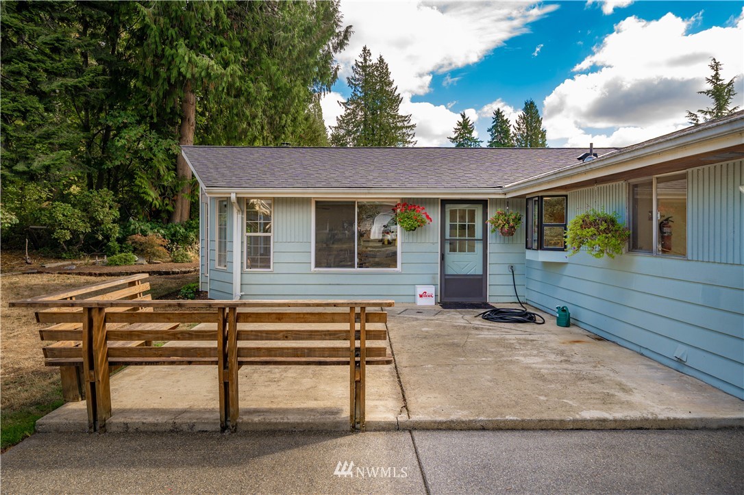 18003 Rhodes Lake Road East Bonney Lake, WA 98391 - Photo 33 of 40 a view of a house with backyard and sitting area