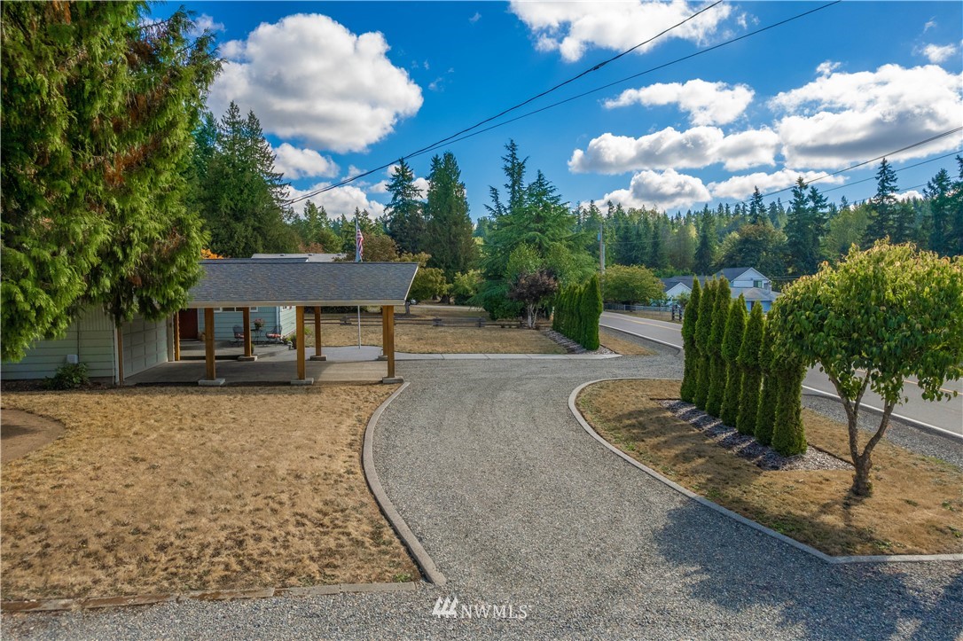 18003 Rhodes Lake Road East Bonney Lake, WA 98391 - Photo 38 of 40 a front view of a house with garden