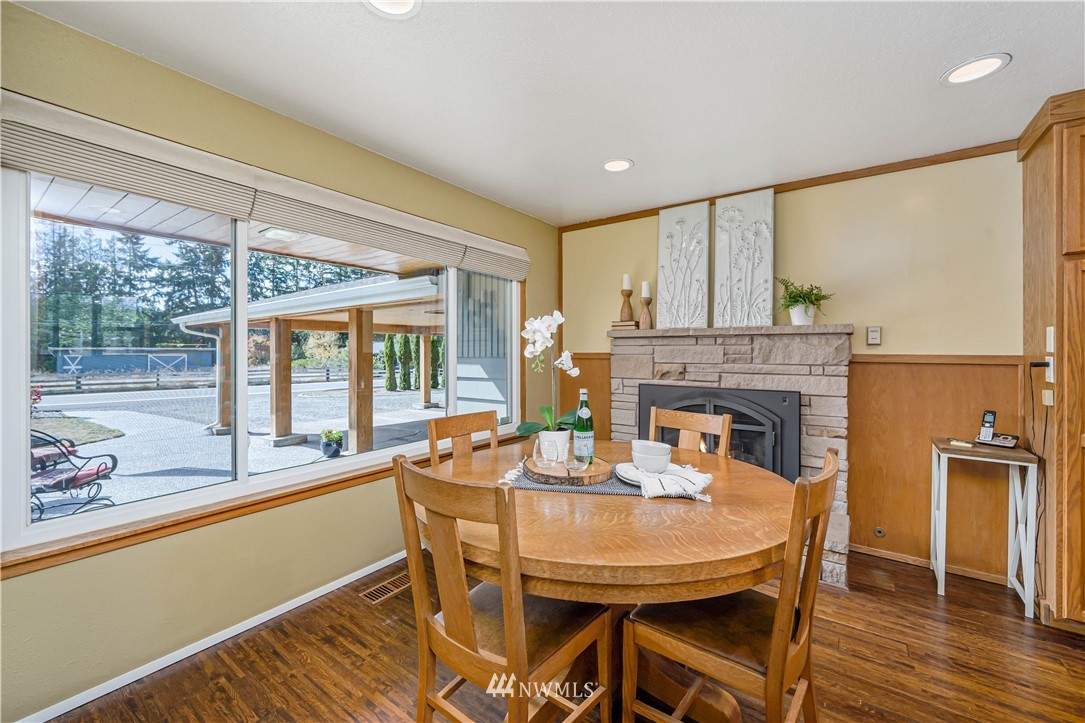 18003 Rhodes Lake Road East Bonney Lake, WA 98391 - Photo 7 of 40 a dining room with furniture window and wooden floor