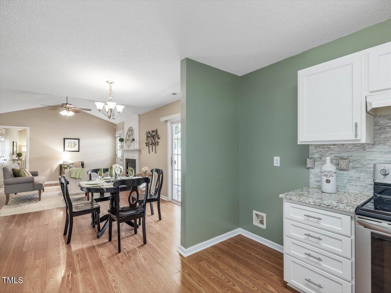 4509 Dolwick Drive Durham, NC 27713 - Photo 12 of 31 a view of a dining room with furniture and wooden floor