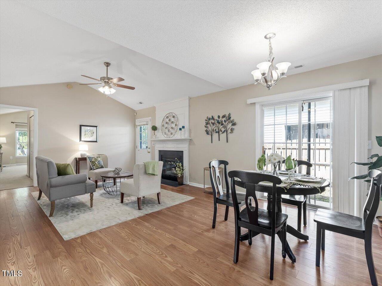 4509 Dolwick Drive Durham, NC 27713 - Photo 13 of 31 a view of a dining room with furniture window and wooden floor