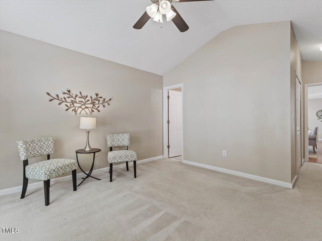 4509 Dolwick Drive Durham, NC 27713 - Photo 18 of 31 a living room with furniture and a chandelier