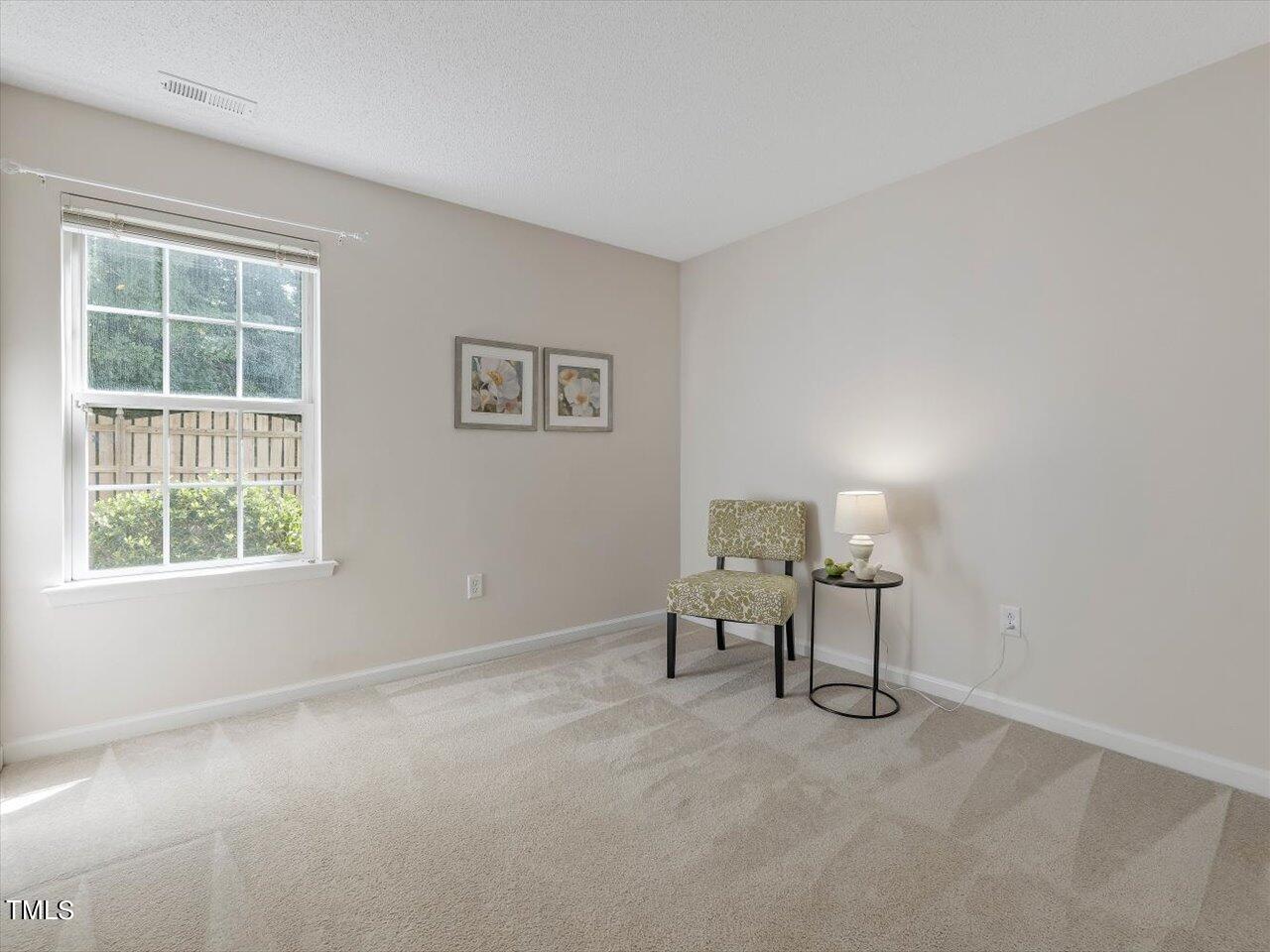 4509 Dolwick Drive Durham, NC 27713 - Photo 24 of 31 a living room with furniture and a window