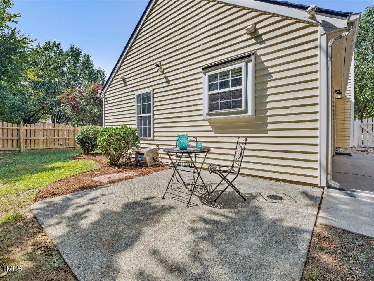 4509 Dolwick Drive Durham, NC 27713 - Photo 27 of 31 a view of a house with backyard and sitting area