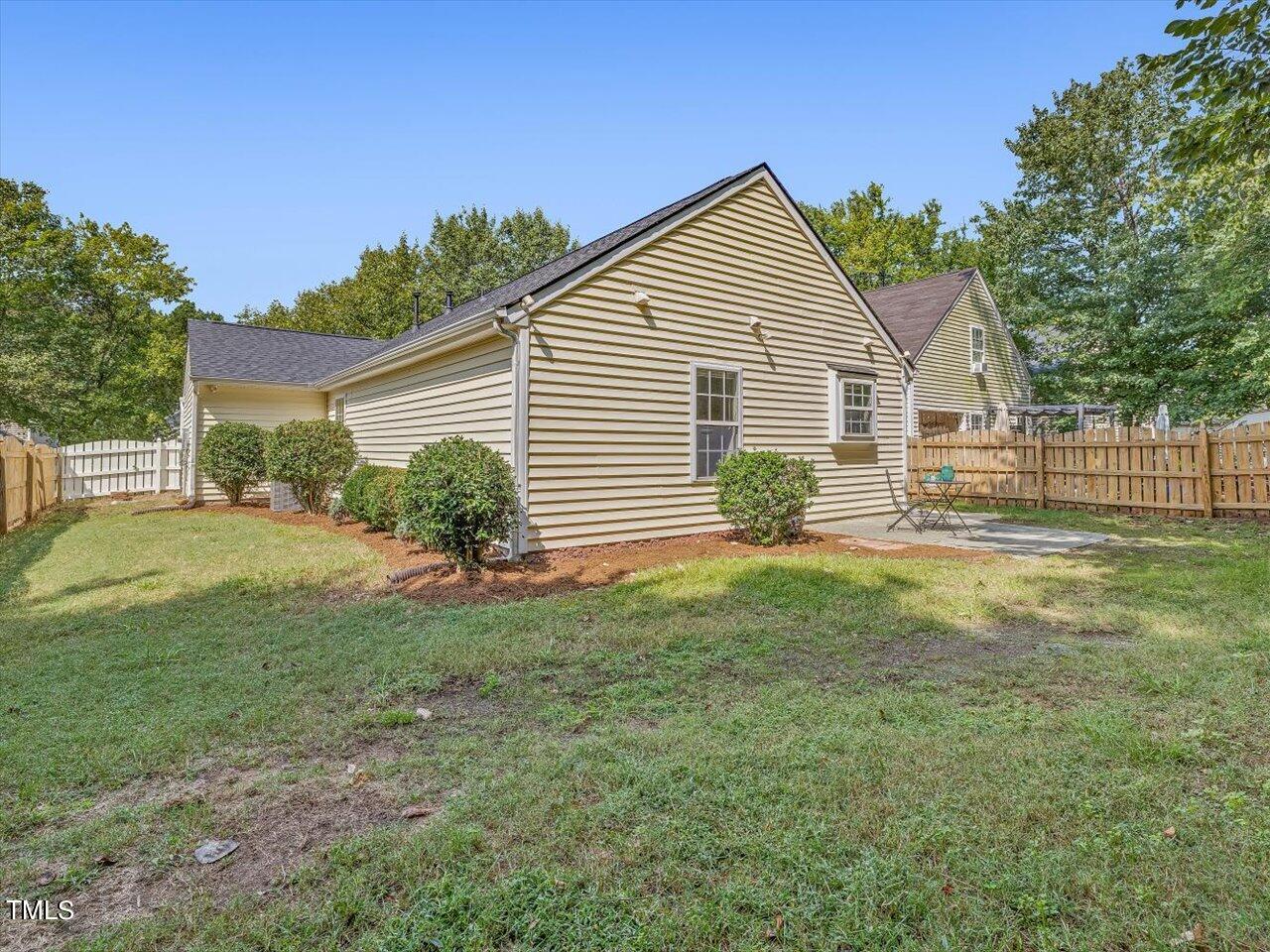 4509 Dolwick Drive Durham, NC 27713 - Photo 28 of 31 a view of a house with a backyard