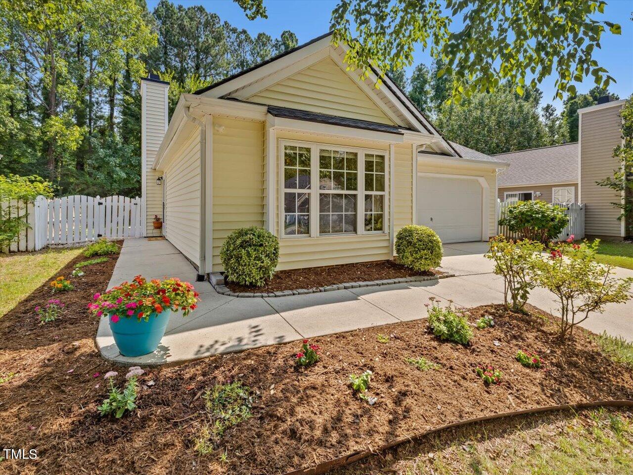 4509 Dolwick Drive Durham, NC 27713 - Photo 3 of 31 a front view of a house with a yard