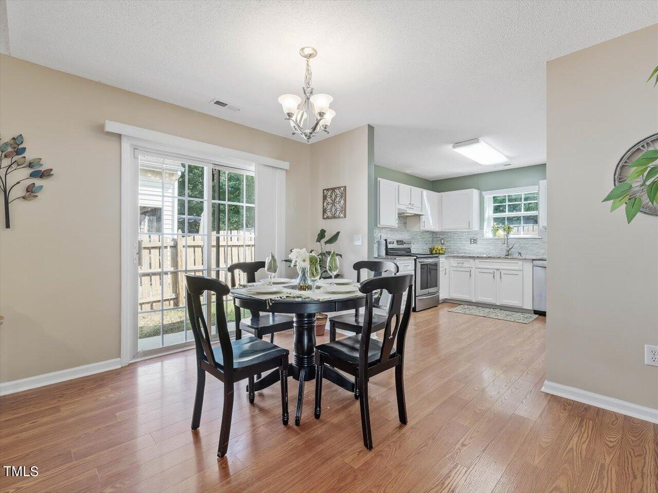 4509 Dolwick Drive Durham, NC 27713 - Photo 8 of 31 a view of a dining room with furniture window and wooden floor