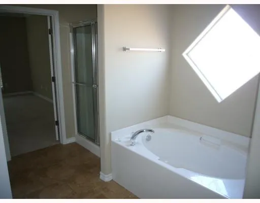 a bathroom with a bathtub and shower