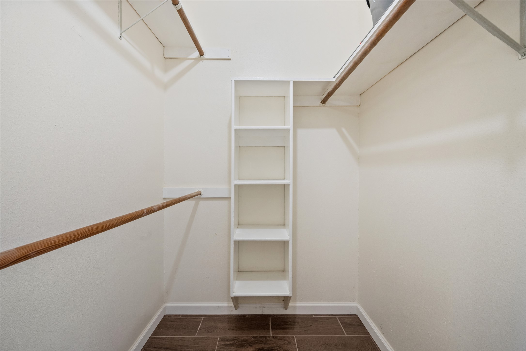 3930 Tumbleweed Lane Baytown, TX 77521 - Photo 14 of 23 a view of walk in closet with empty racks