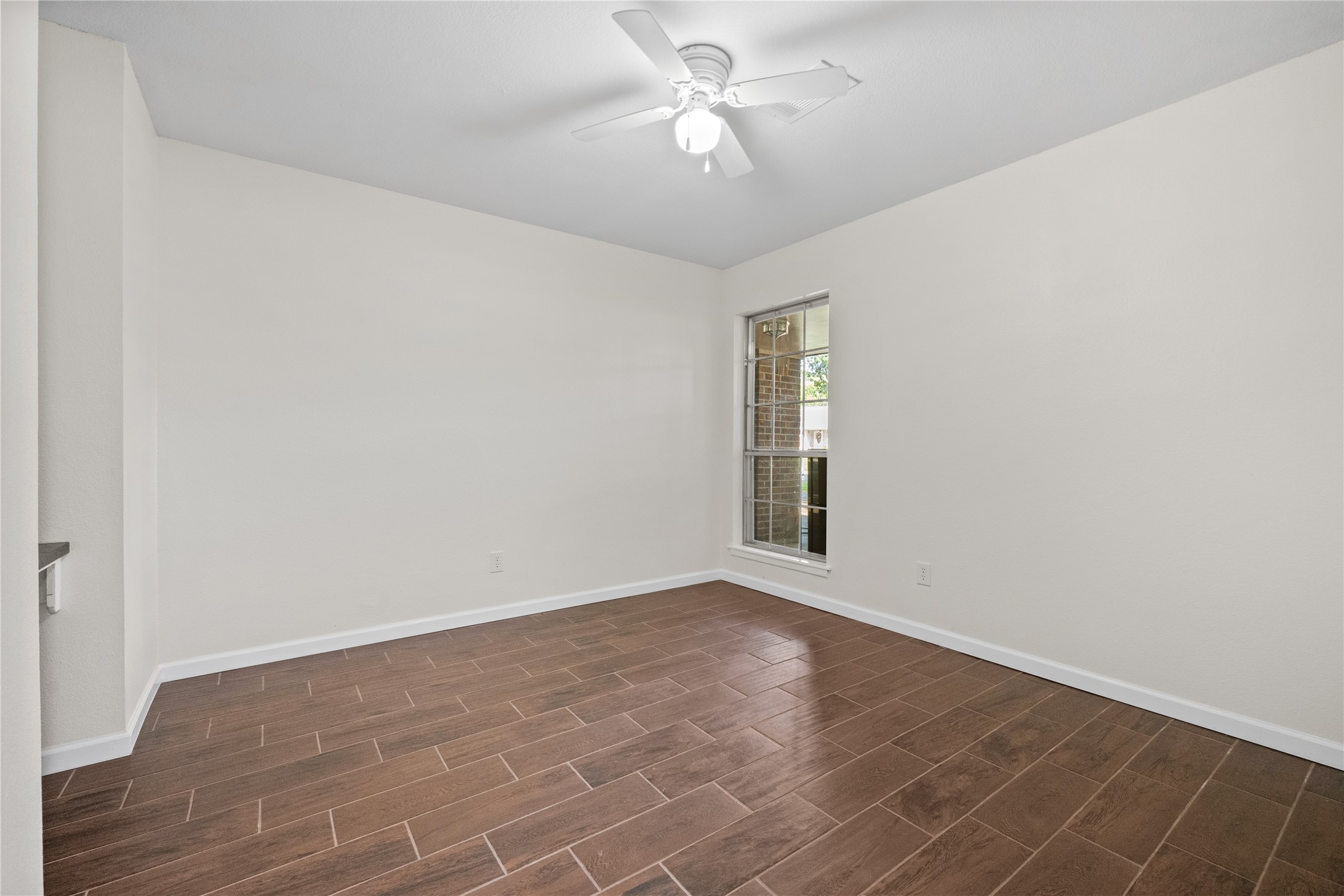 3930 Tumbleweed Lane Baytown, TX 77521 - Photo 16 of 23 an empty room with a empty space and a ceiling fan