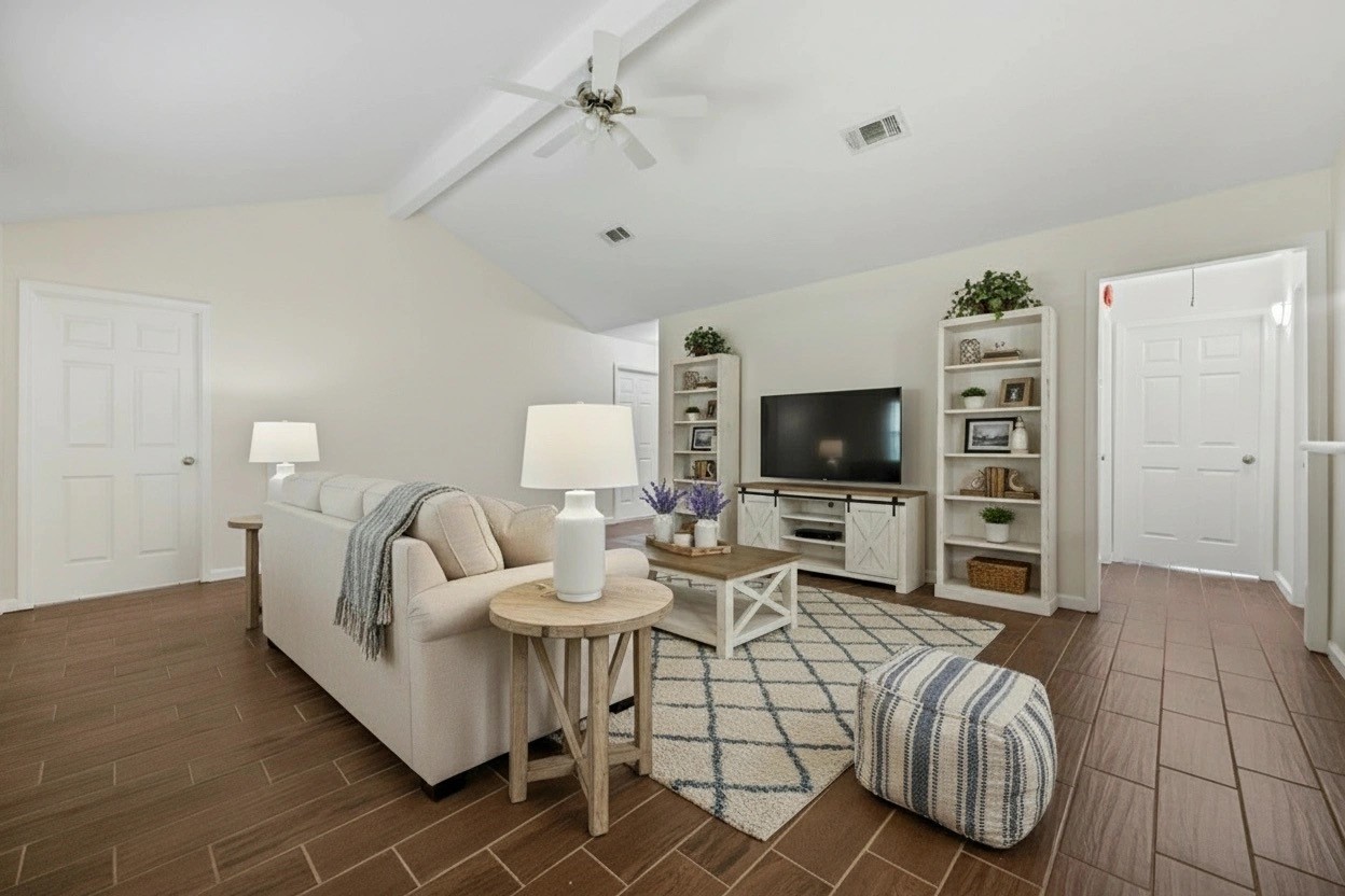 3930 Tumbleweed Lane Baytown, TX 77521 - Photo 3 of 23 a living room with furniture and a flat screen tv