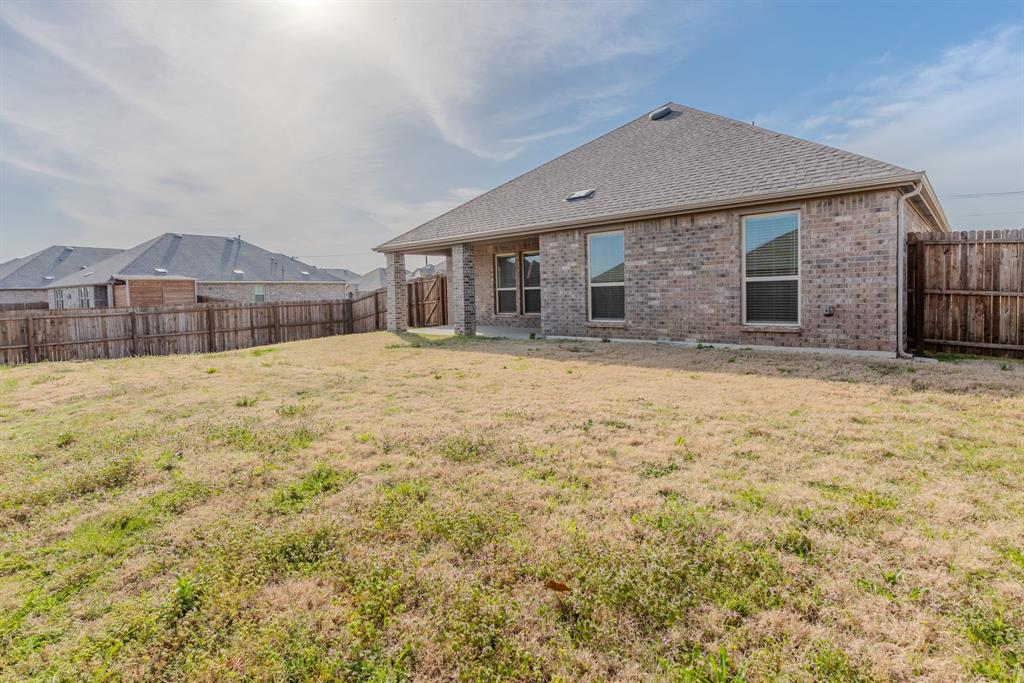 2902 Trusting Way Aubrey, TX 76227 - Photo 35 of 38 Expansive backyard space with a full privacy fence
