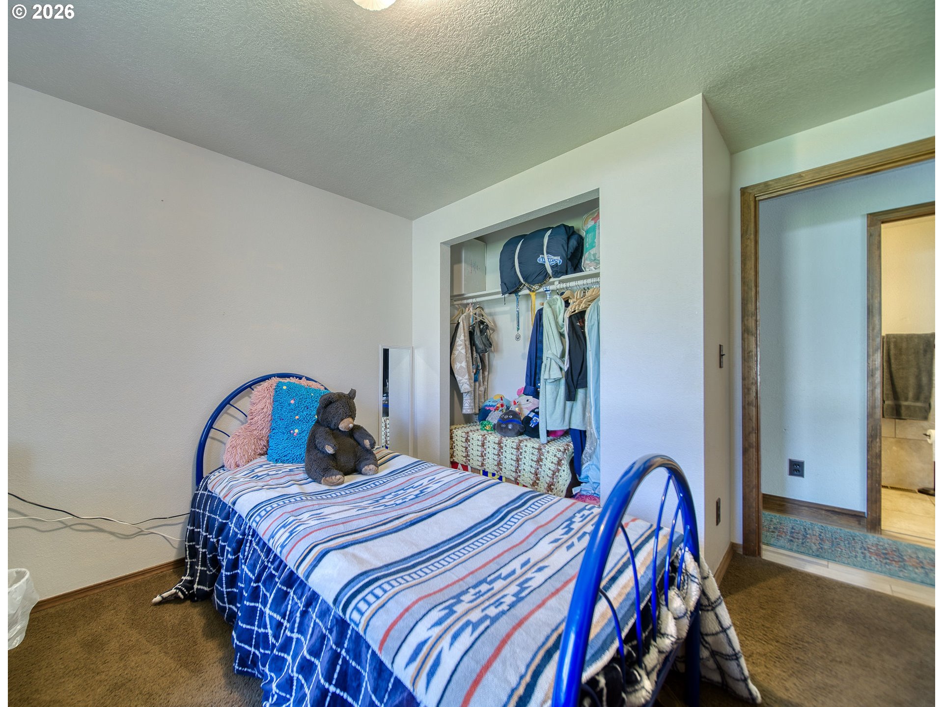 52320 Southwest Taylor Street Scappoose, OR 97056 - Photo 14 of 48 a bedroom with a bed and a mirror