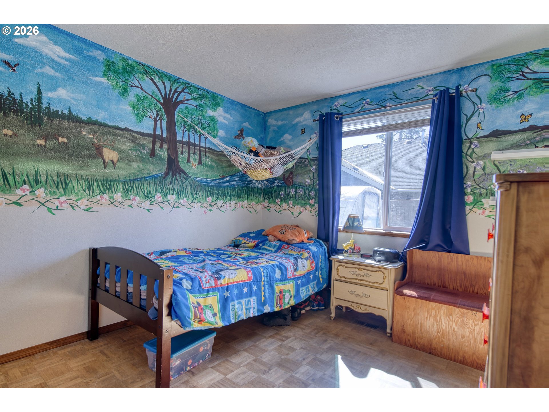 52320 Southwest Taylor Street Scappoose, OR 97056 - Photo 16 of 48 a bedroom with a bed and a balcony view