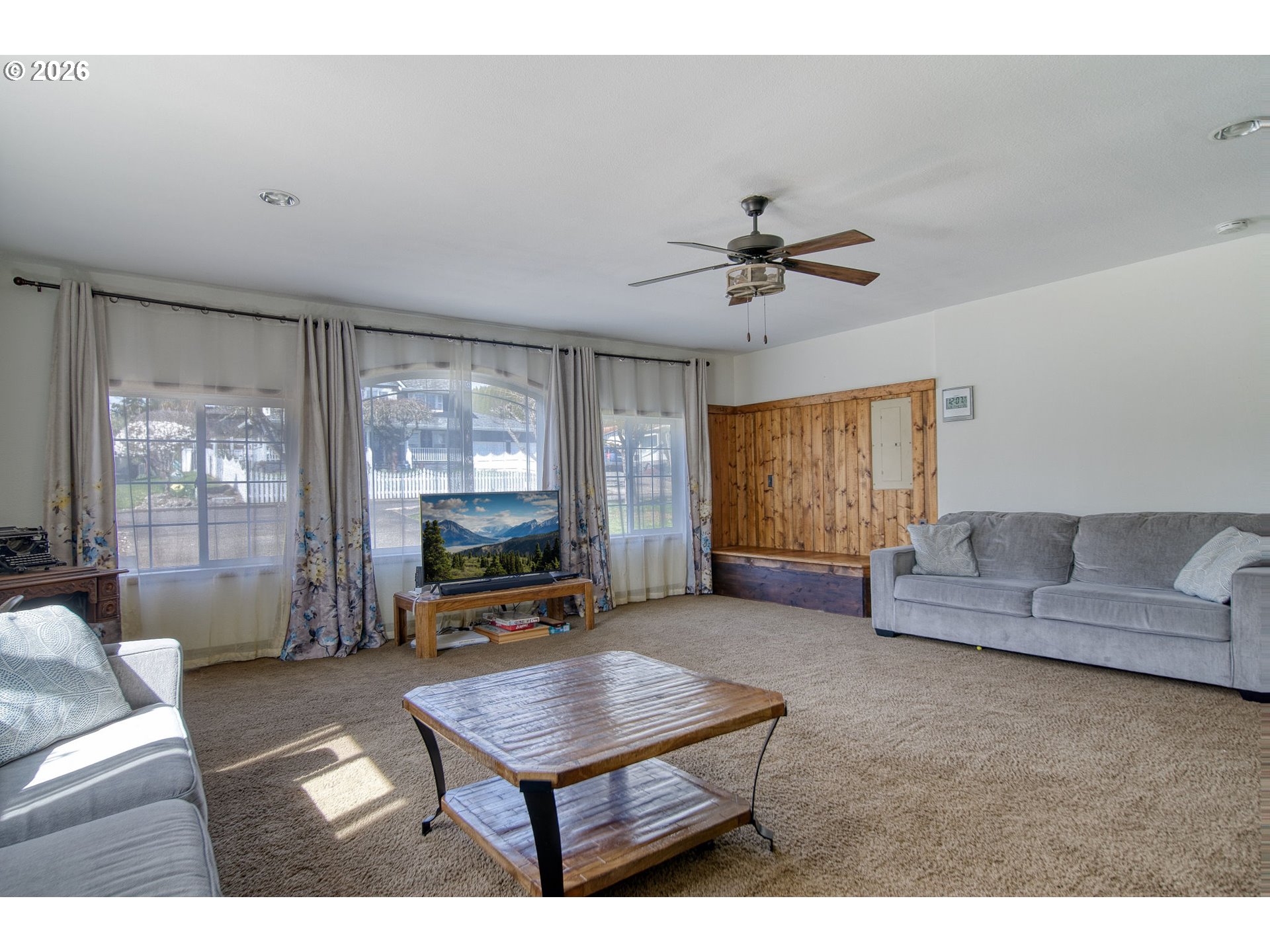 52320 Southwest Taylor Street Scappoose, OR 97056 - Photo 22 of 48 a living room with furniture a flat screen tv and a large window