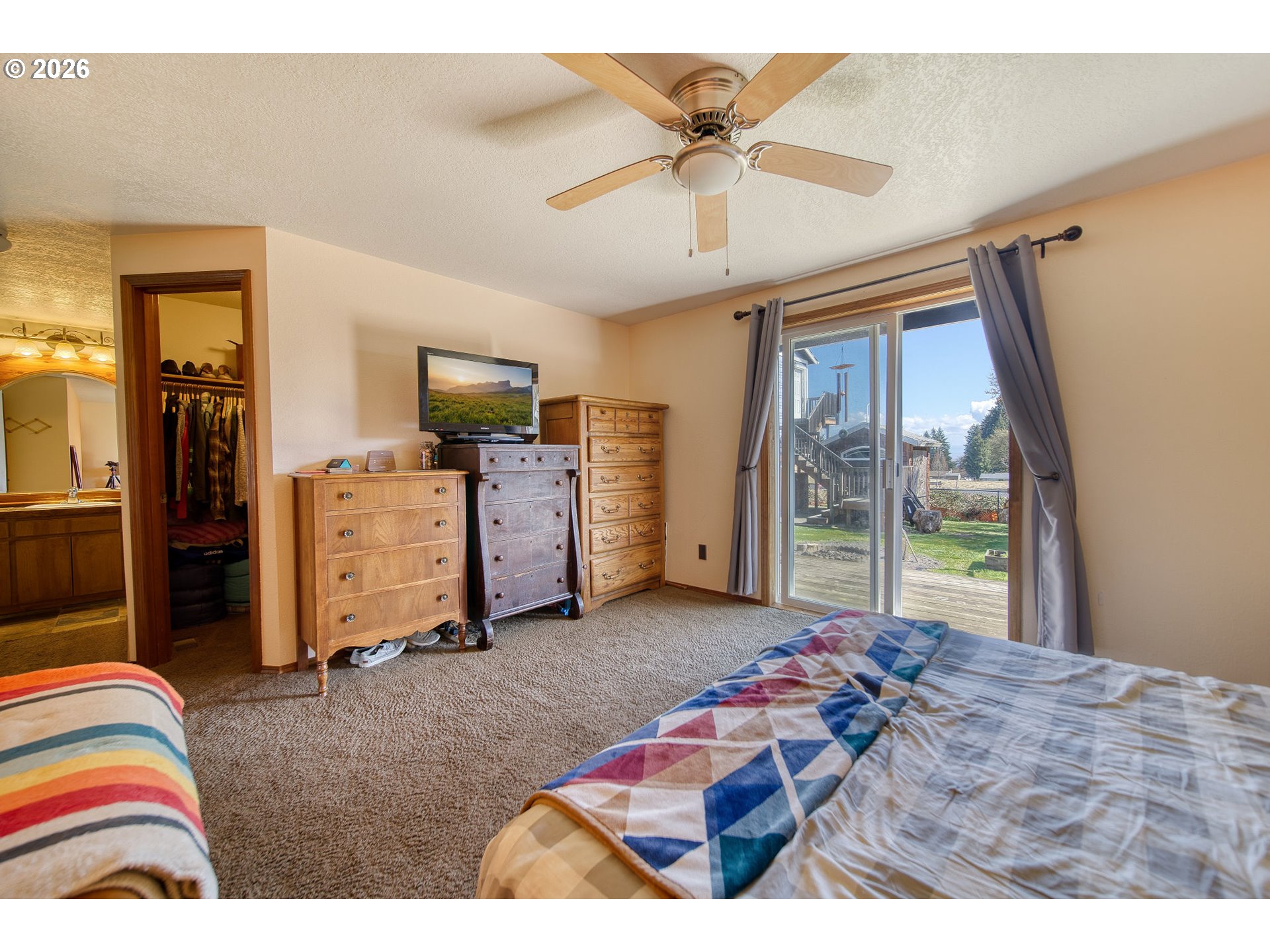 52320 Southwest Taylor Street Scappoose, OR 97056 - Photo 24 of 48 a living room with furniture and a flat screen tv