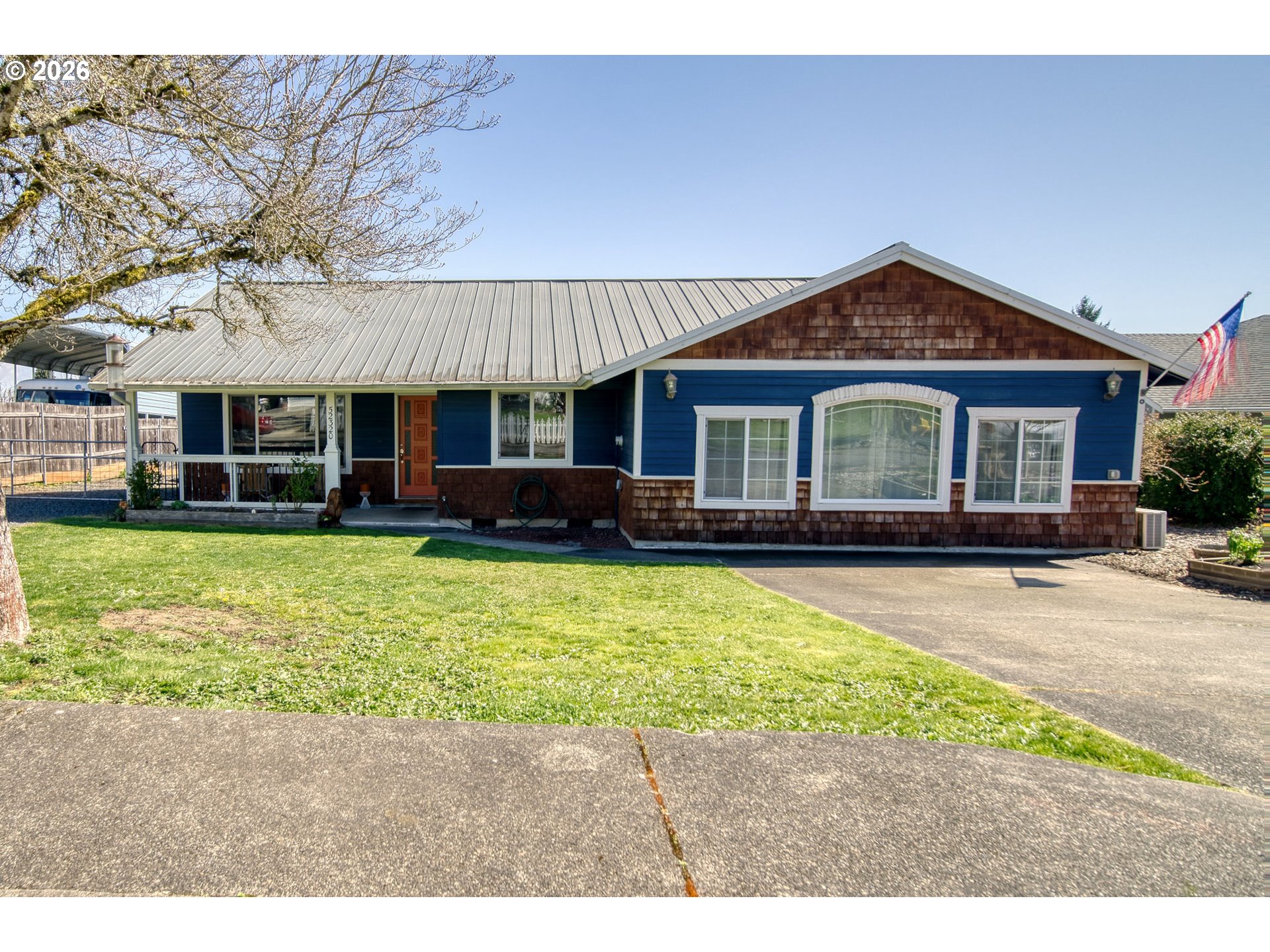 52320 Southwest Taylor Street Scappoose, OR 97056 - Photo 26 of 48 a front view of a house with a garden