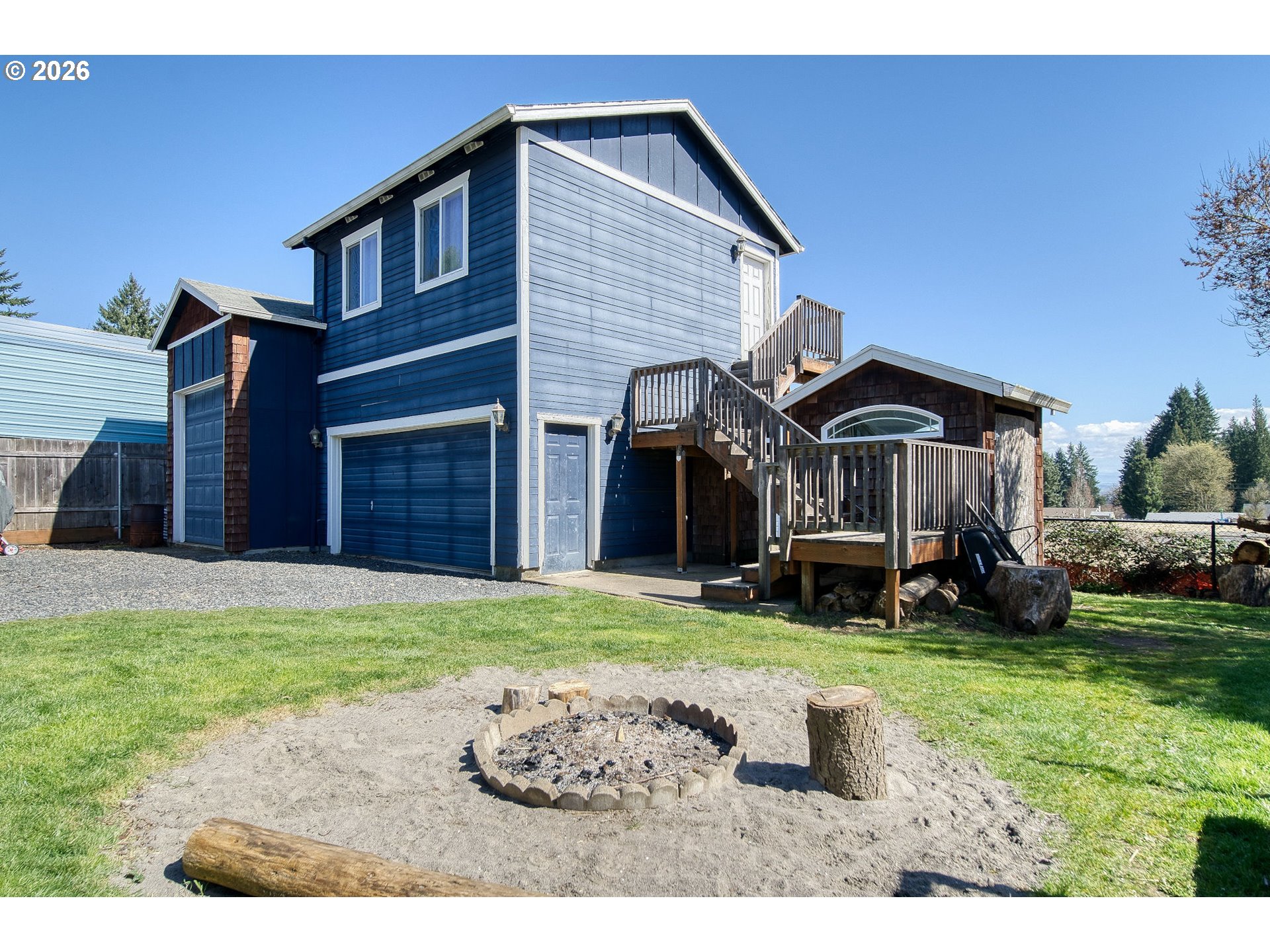 52320 Southwest Taylor Street Scappoose, OR 97056 - Photo 31 of 48 a backyard of a house with table and chairs