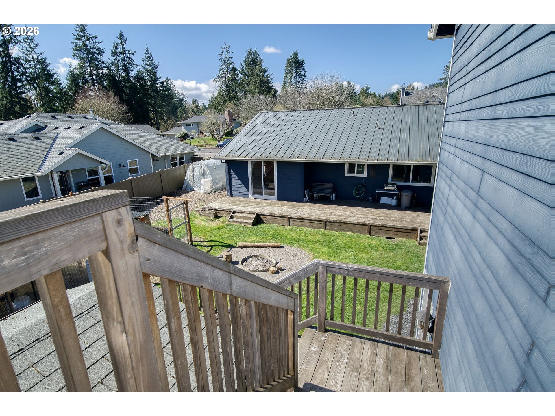 52320 Southwest Taylor Street Scappoose, OR 97056 - Photo 38 of 48 a view of a wooden chairs and a table in the balcony