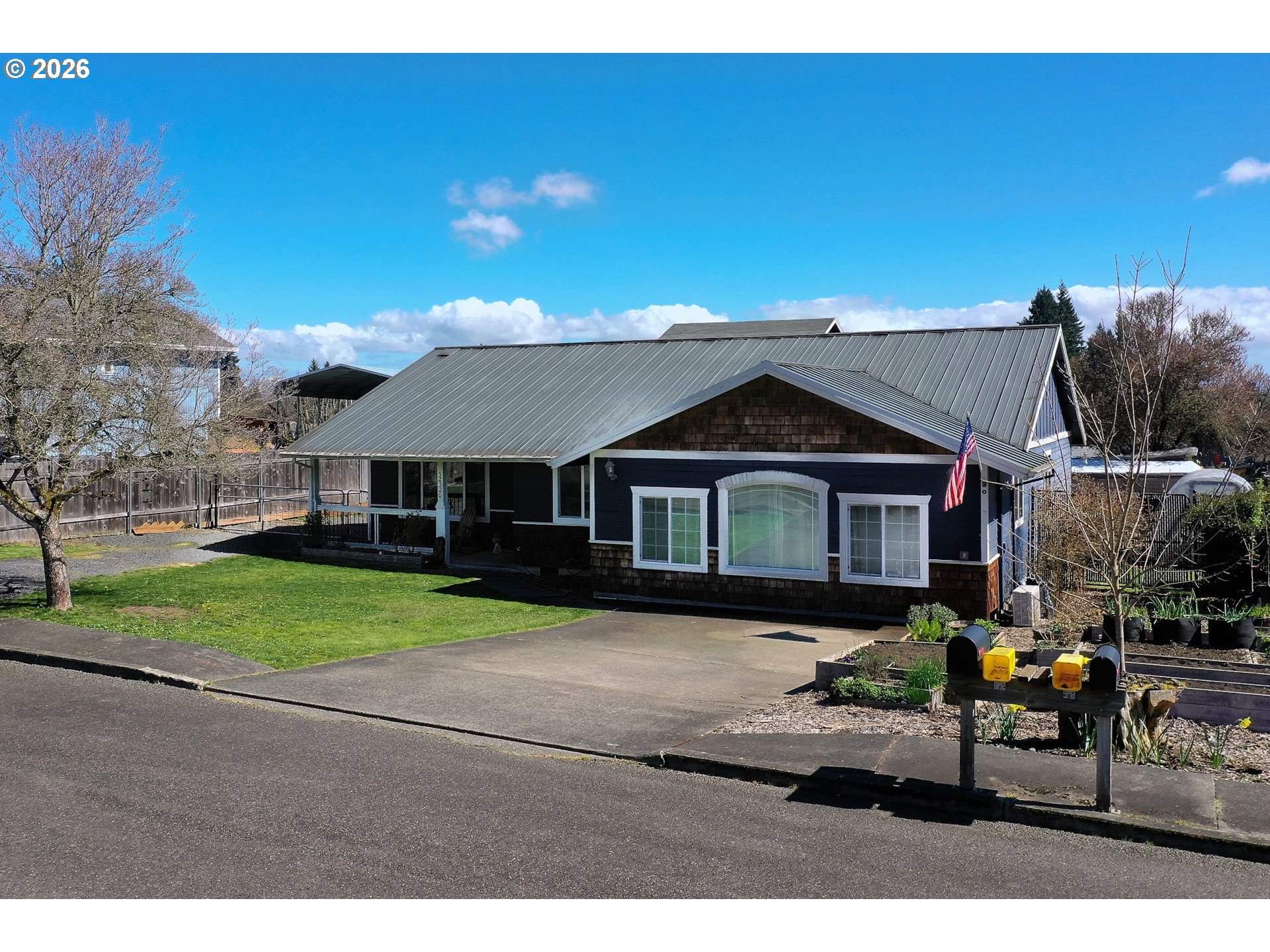 52320 Southwest Taylor Street Scappoose, OR 97056 - Photo 45 of 48 a front view of a house with a yard