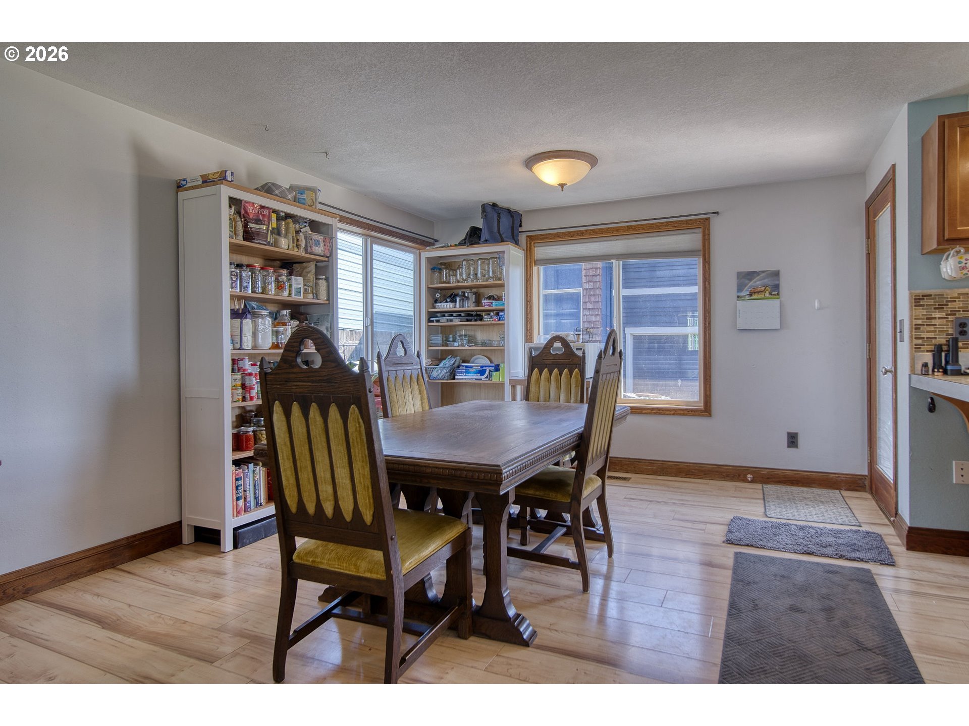 52320 Southwest Taylor Street Scappoose, OR 97056 - Photo 6 of 48 a view of a dining room with furniture and window