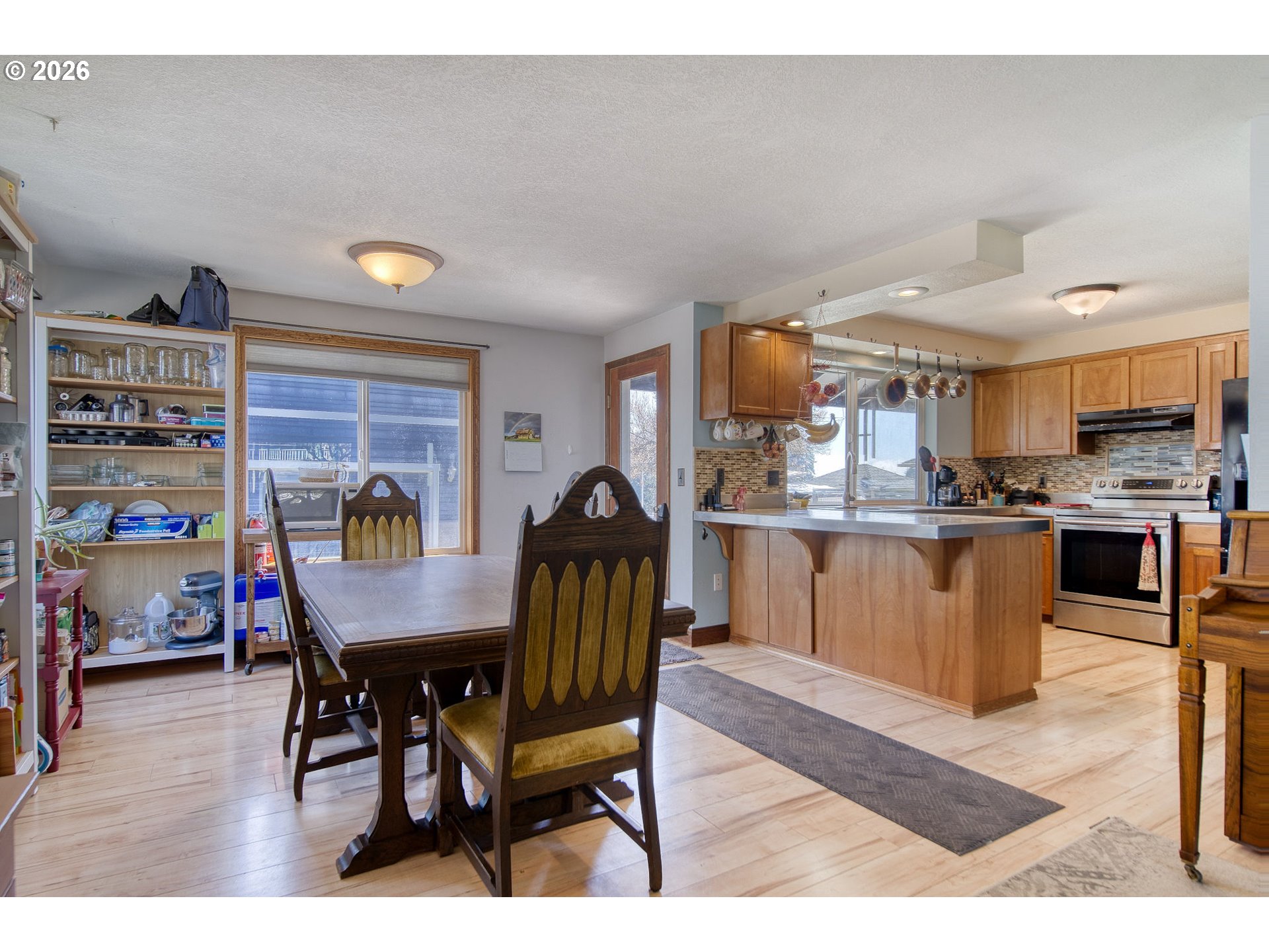 52320 Southwest Taylor Street Scappoose, OR 97056 - Photo 7 of 48 a dining room with furniture and wooden floor