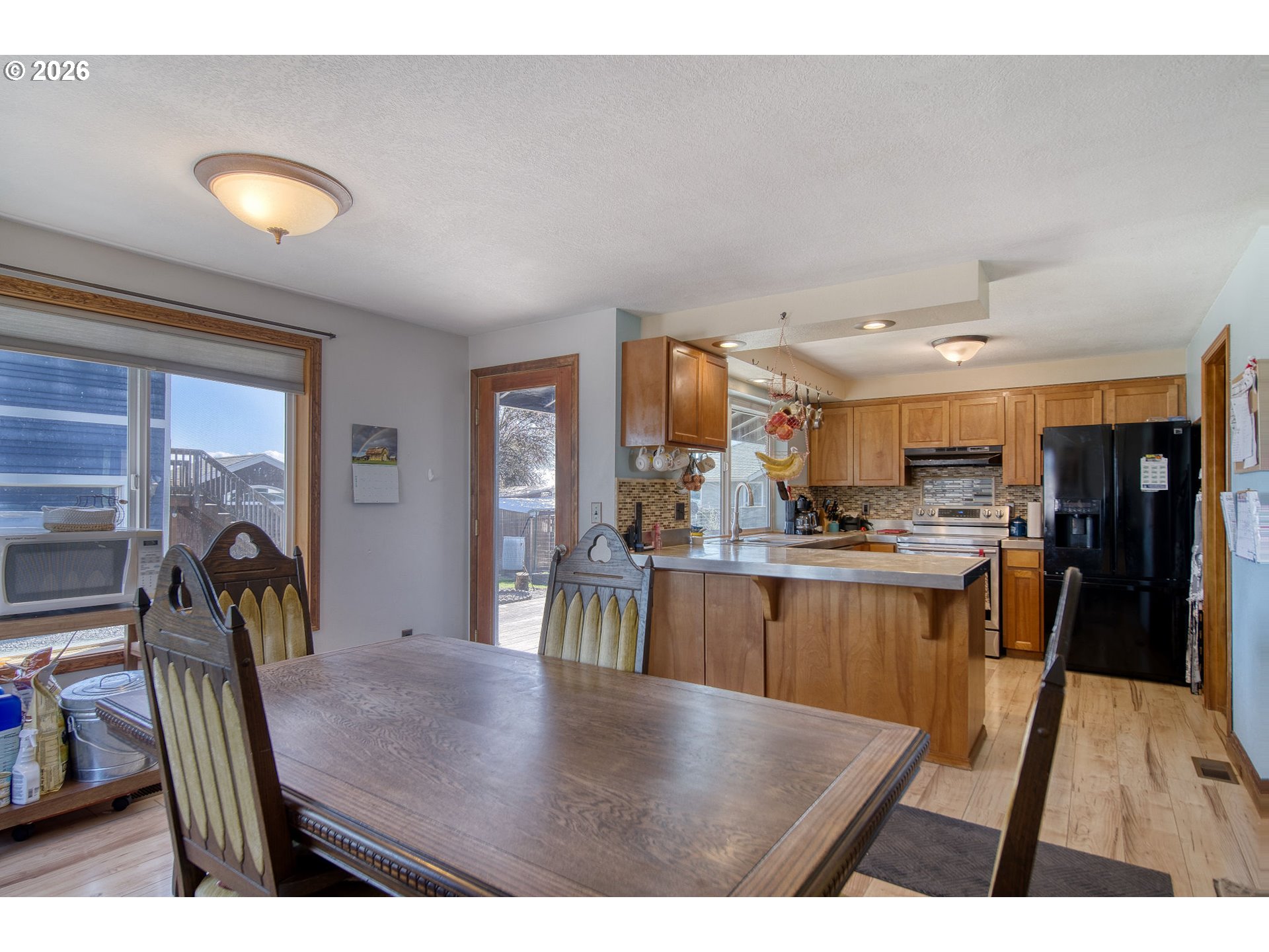 52320 Southwest Taylor Street Scappoose, OR 97056 - Photo 8 of 48 a kitchen with stainless steel appliances granite countertop a refrigerator a stove and a sink with granite countertops