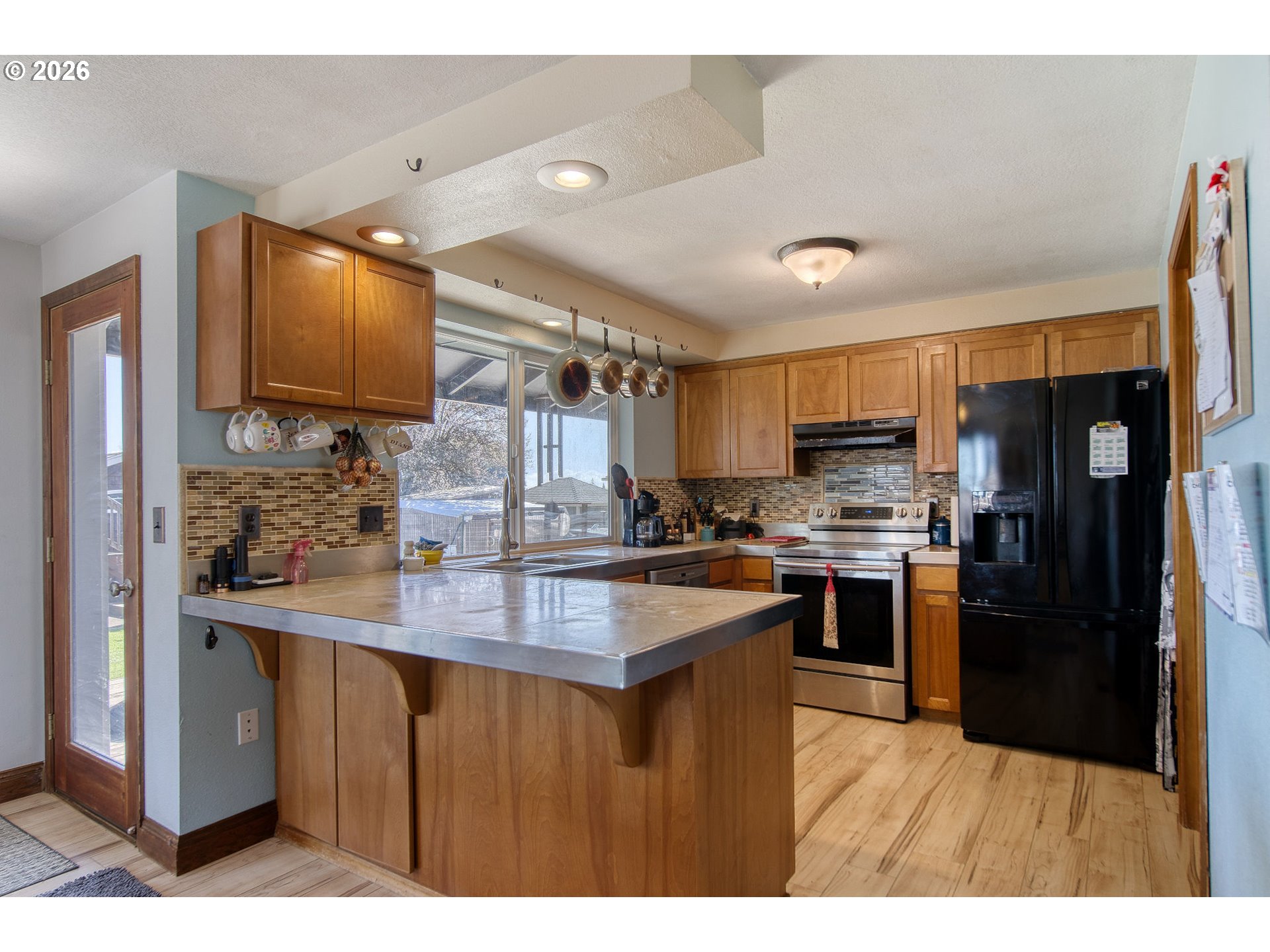 52320 Southwest Taylor Street Scappoose, OR 97056 - Photo 9 of 48 a kitchen with refrigerator and cabinets