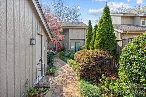 a backyard of a house with lots of green space