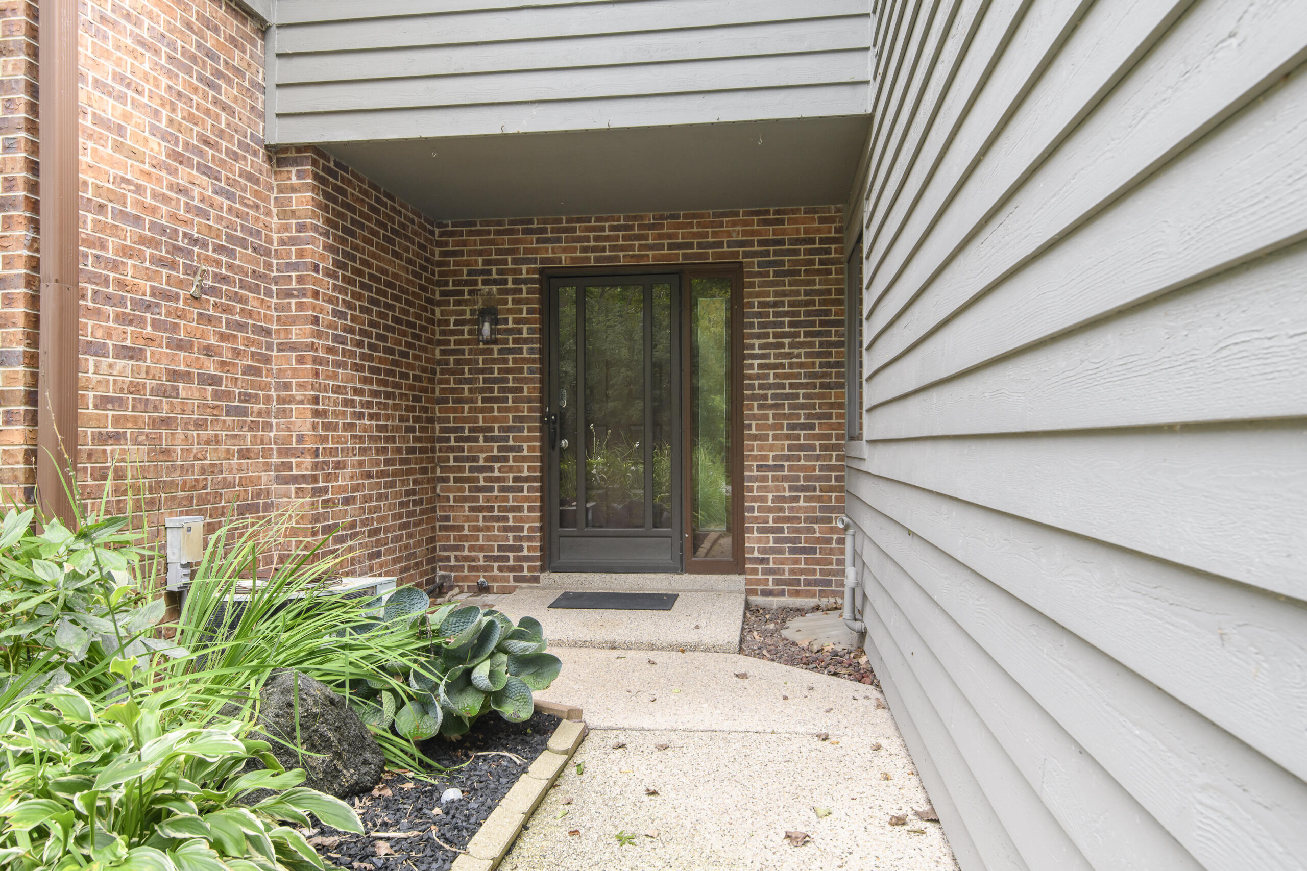 2906 Old Mill Drive, Unit A3 Racine, WI 53404 - Photo 2 of 37 Private Entrance & DIY Planter Area