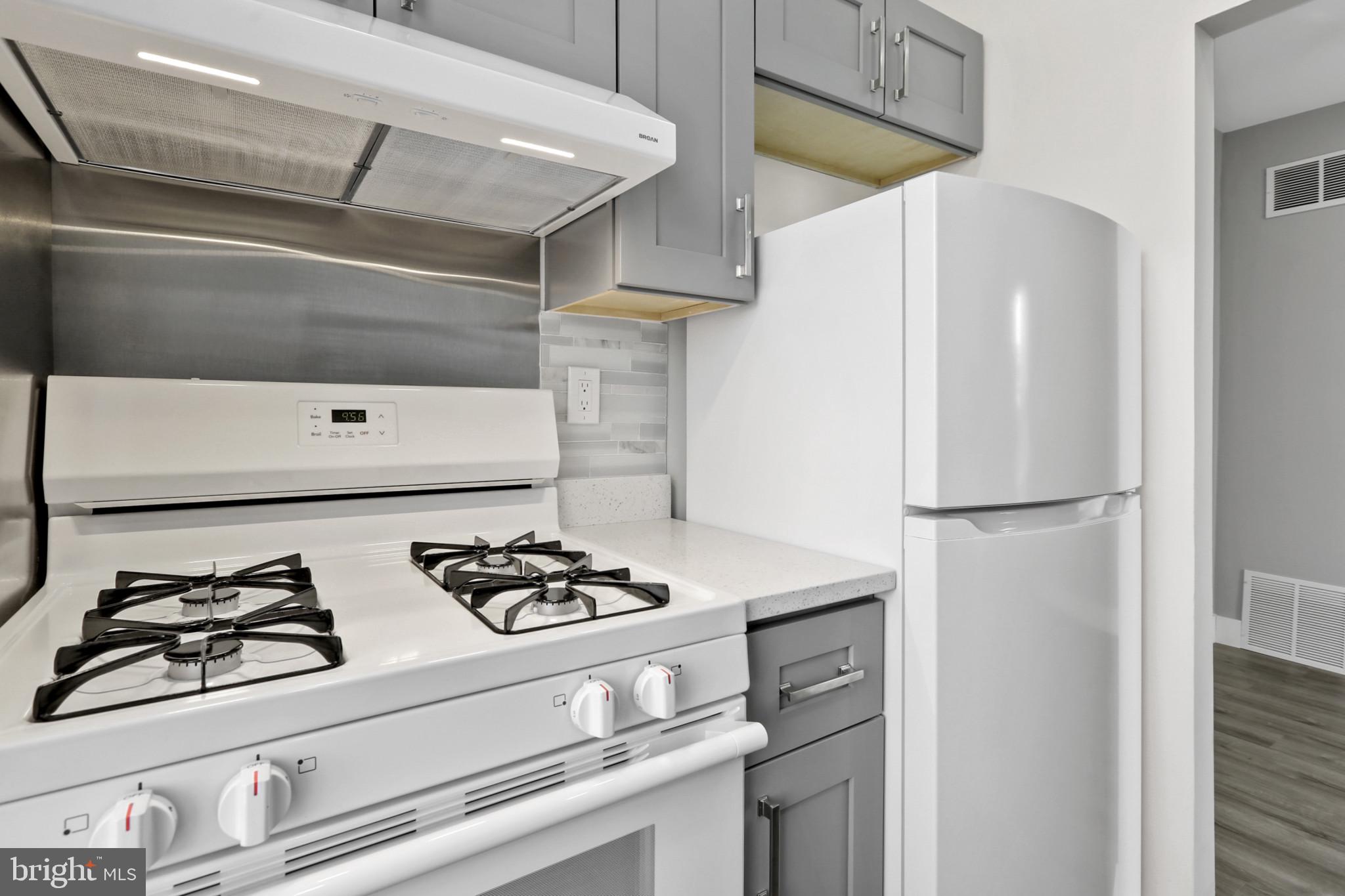 3600 Keswick Road, Unit B Baltimore, MD 21211 - Photo 17 of 23 a white refrigerator freezer sitting inside of a kitchen