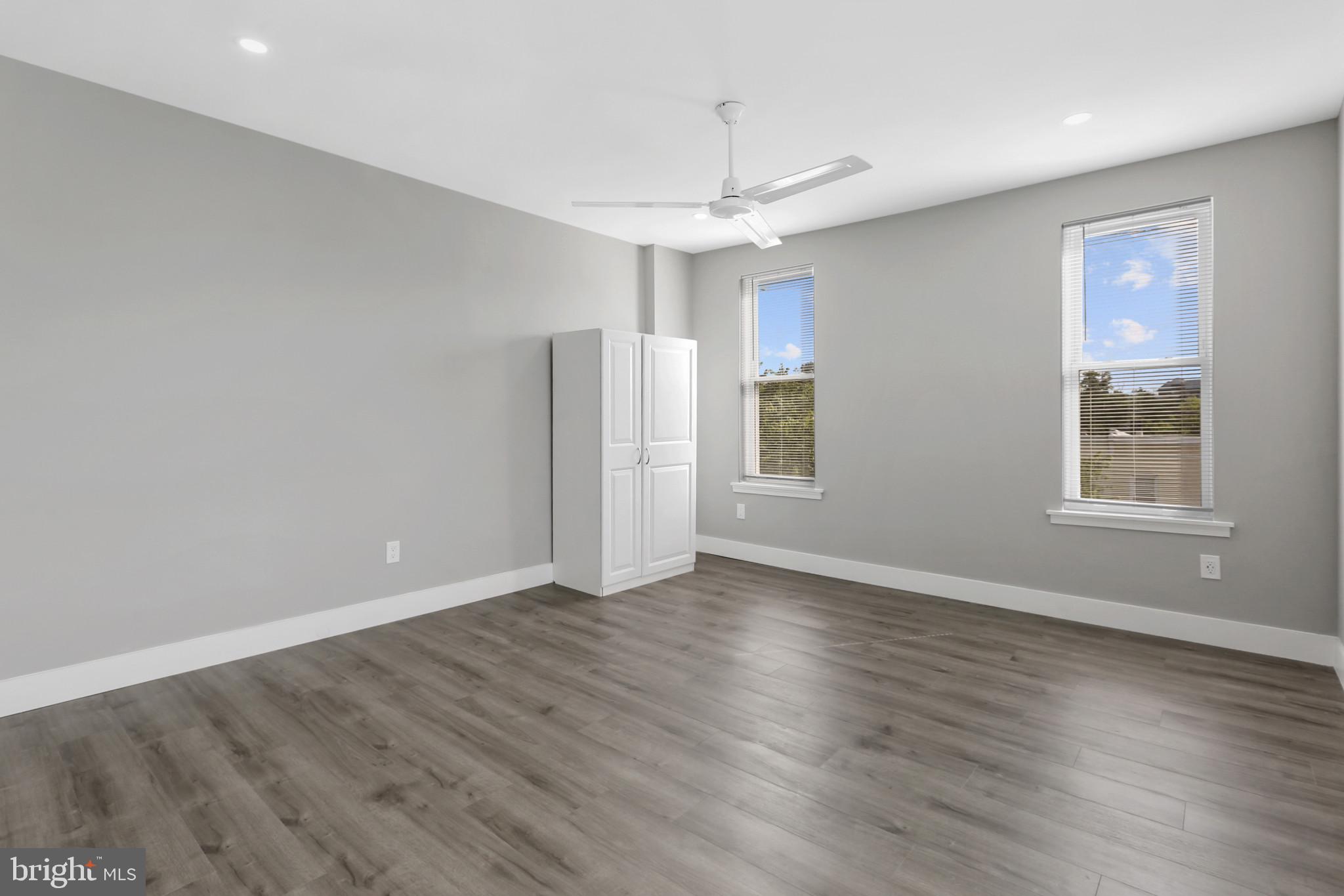 3600 Keswick Road, Unit B Baltimore, MD 21211 - Photo 19 of 23 a view of an empty room with wooden floor and a window