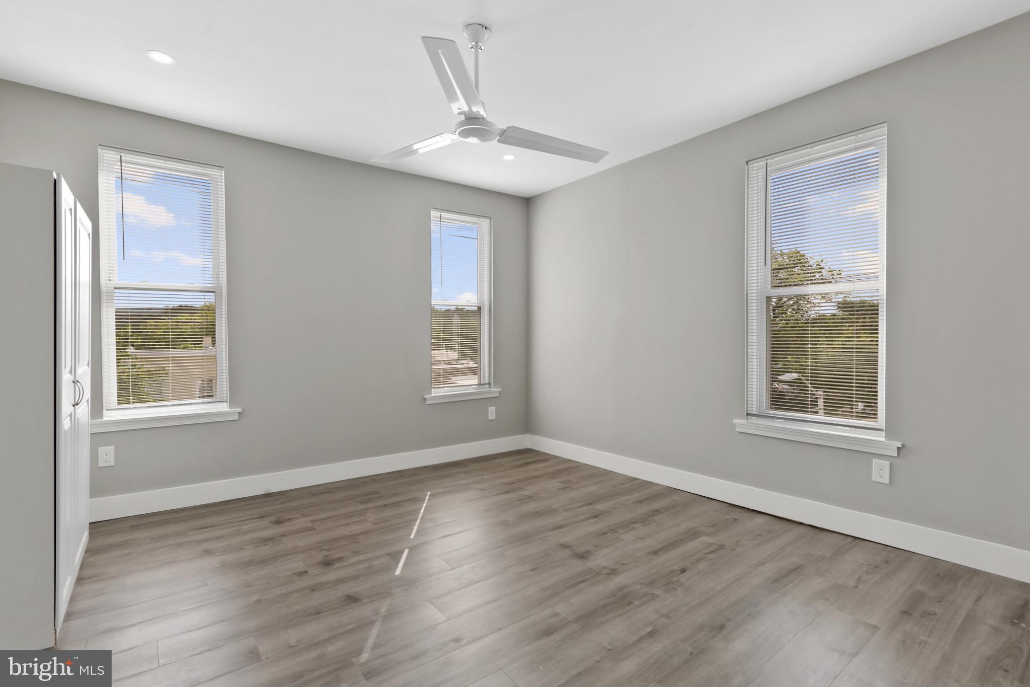 3600 Keswick Road, Unit B Baltimore, MD 21211 - Photo 20 of 23 a view of an empty room with wooden floor and a window