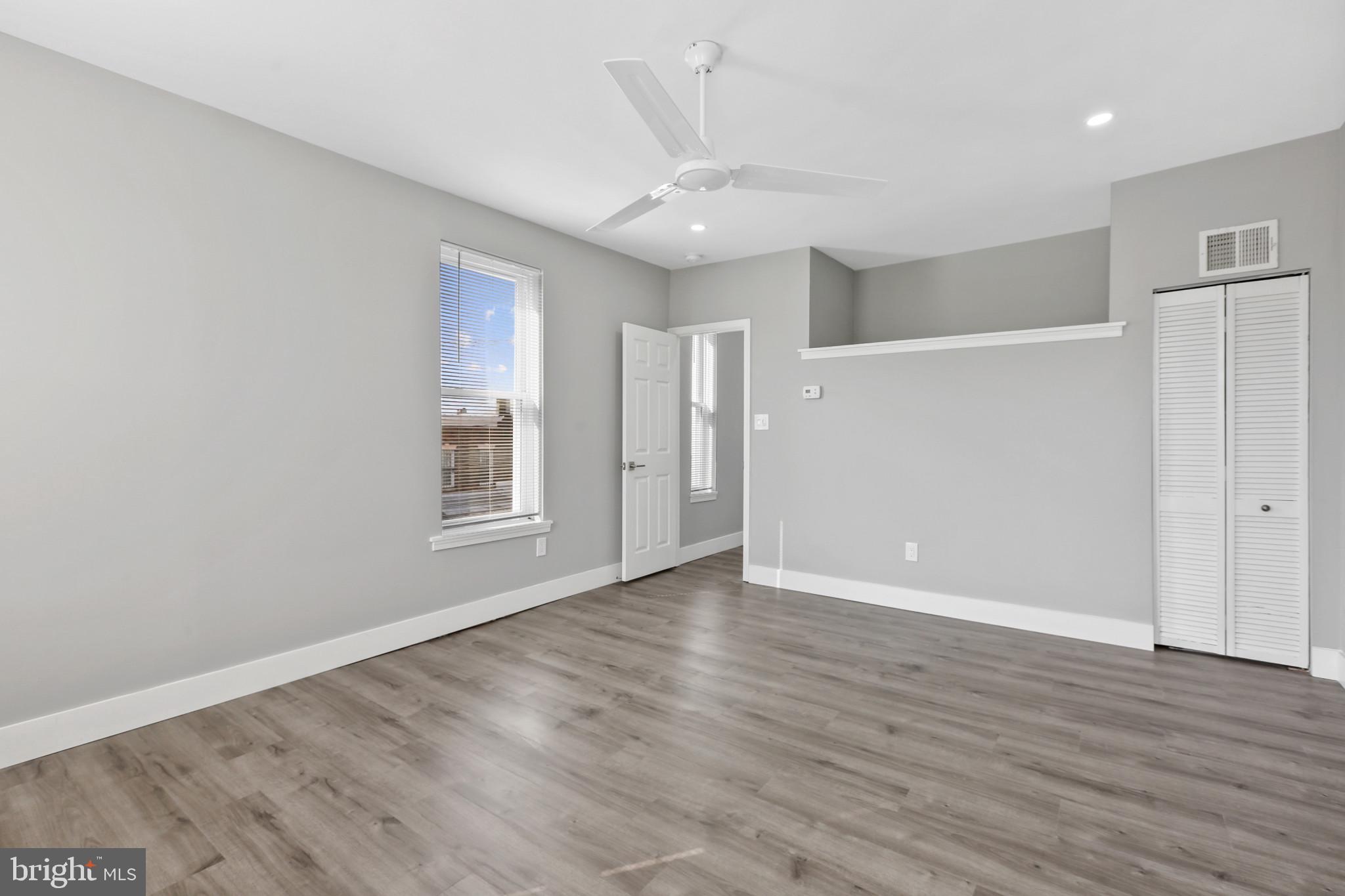 3600 Keswick Road, Unit B Baltimore, MD 21211 - Photo 21 of 23 a view of an empty room with wooden floor