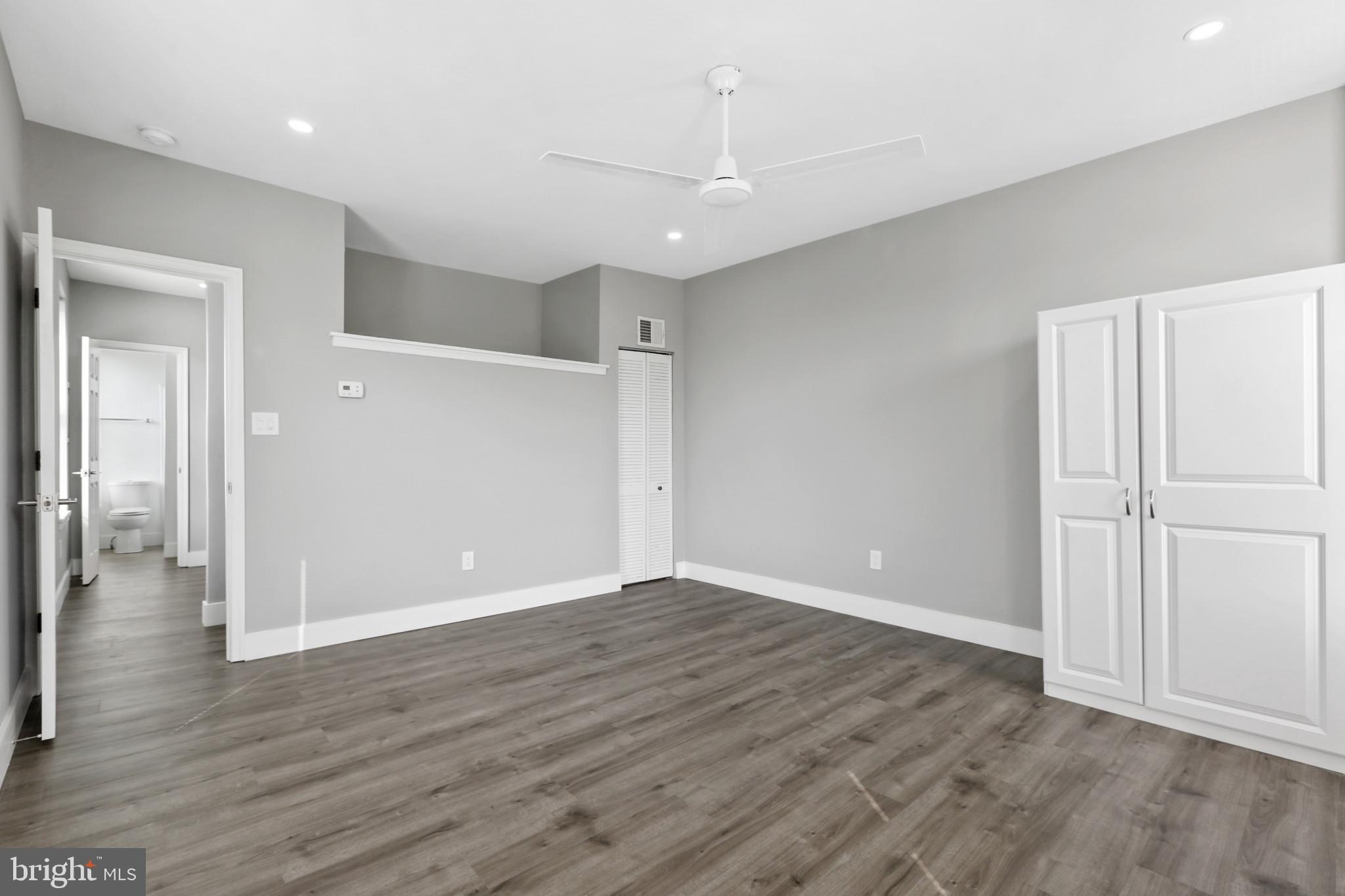 3600 Keswick Road, Unit B Baltimore, MD 21211 - Photo 22 of 23 a view of an empty room with wooden floor