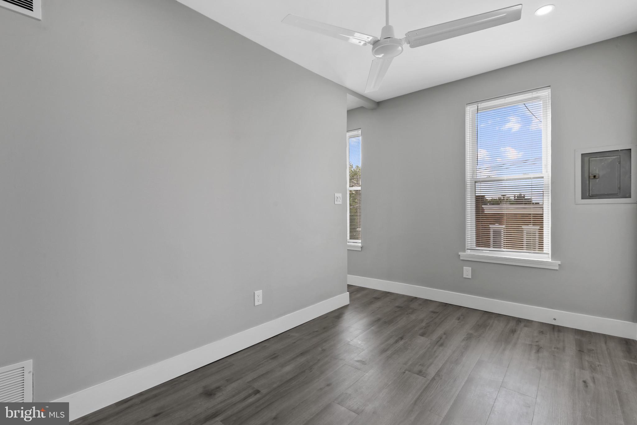 3600 Keswick Road, Unit B Baltimore, MD 21211 - Photo 6 of 23 an empty room with wooden floor and windows