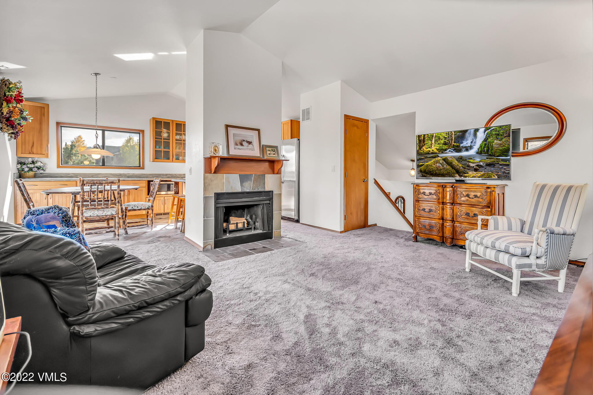 155 Meile Lane Edwards, CO 81632 - Photo 15 of 26 a living room with furniture a flat screen tv and a fireplace