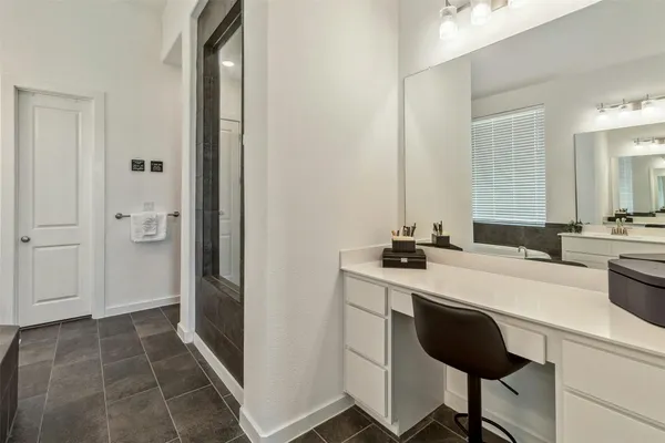 a kitchen with a sink cabinets and appliances