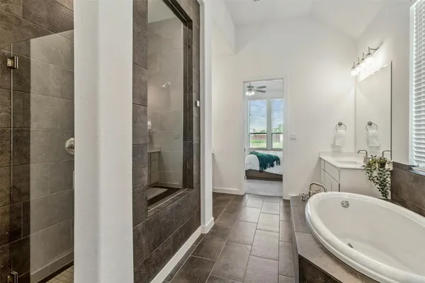 a bathroom with a bathtub and a sink