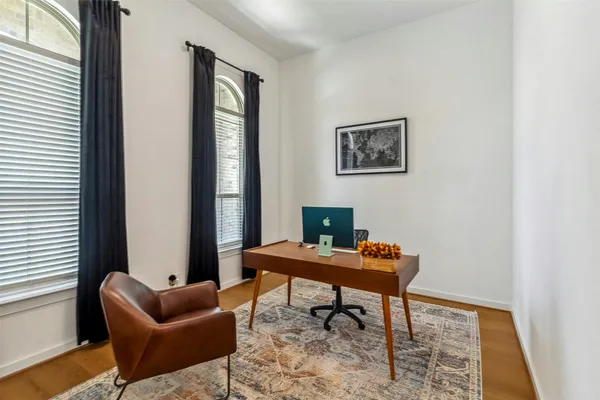 a reading room with furniture and a window
