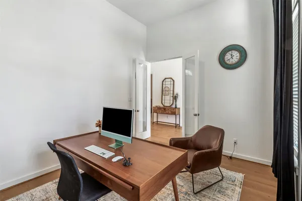 a view of a workspace with furniture