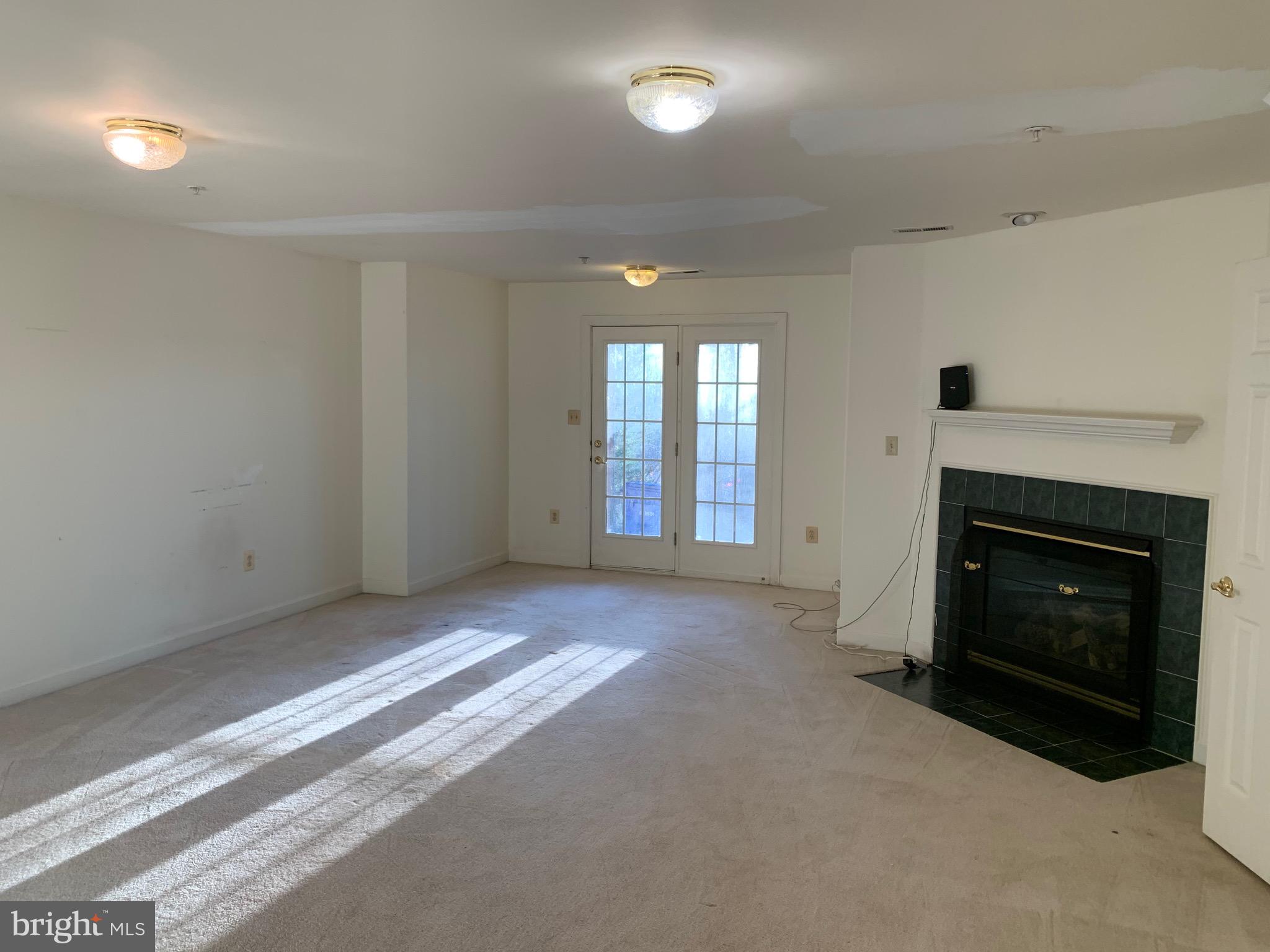 14124 Red Eagle Lane Silver Spring, MD 20906 - Photo 27 of 28 Spacious family room with fireplace and walkout