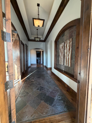 4536 North 475 East Provo, UT 84604 - Photo 40 of 65 Entryway featuring a multi-tone slate tile floor insert bordered by wood-finish flooring