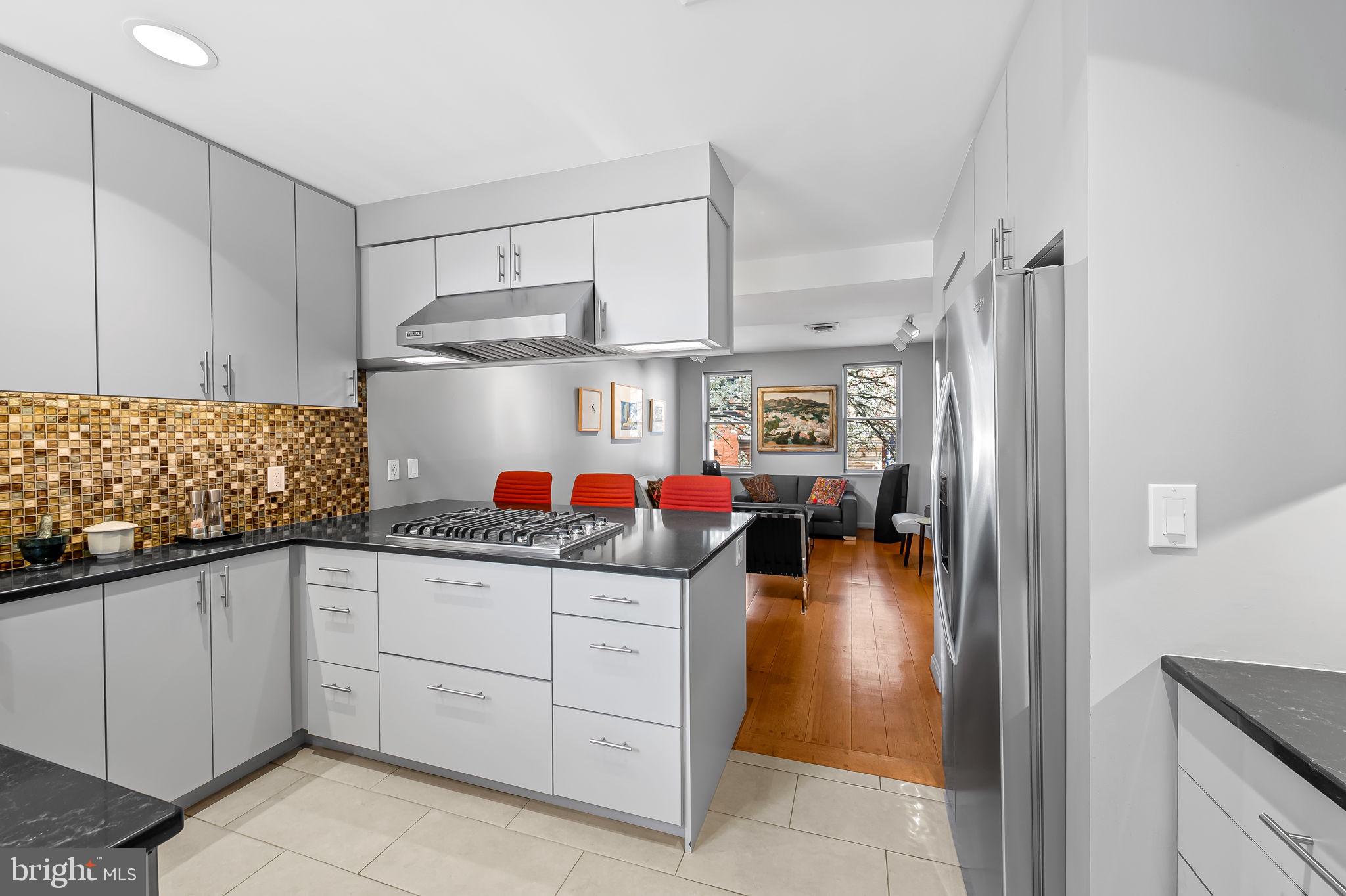 1637 East Baltimore Street Baltimore, MD 21231 - Photo 19 of 39 a kitchen with cabinets and window