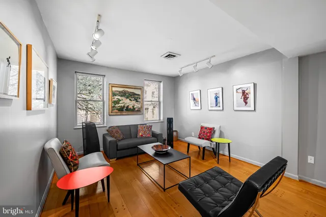 a living room with furniture and a window
